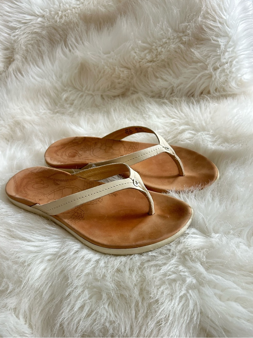 OluKai Women's Honu leather beach sandals in the Bright White/tan sandals